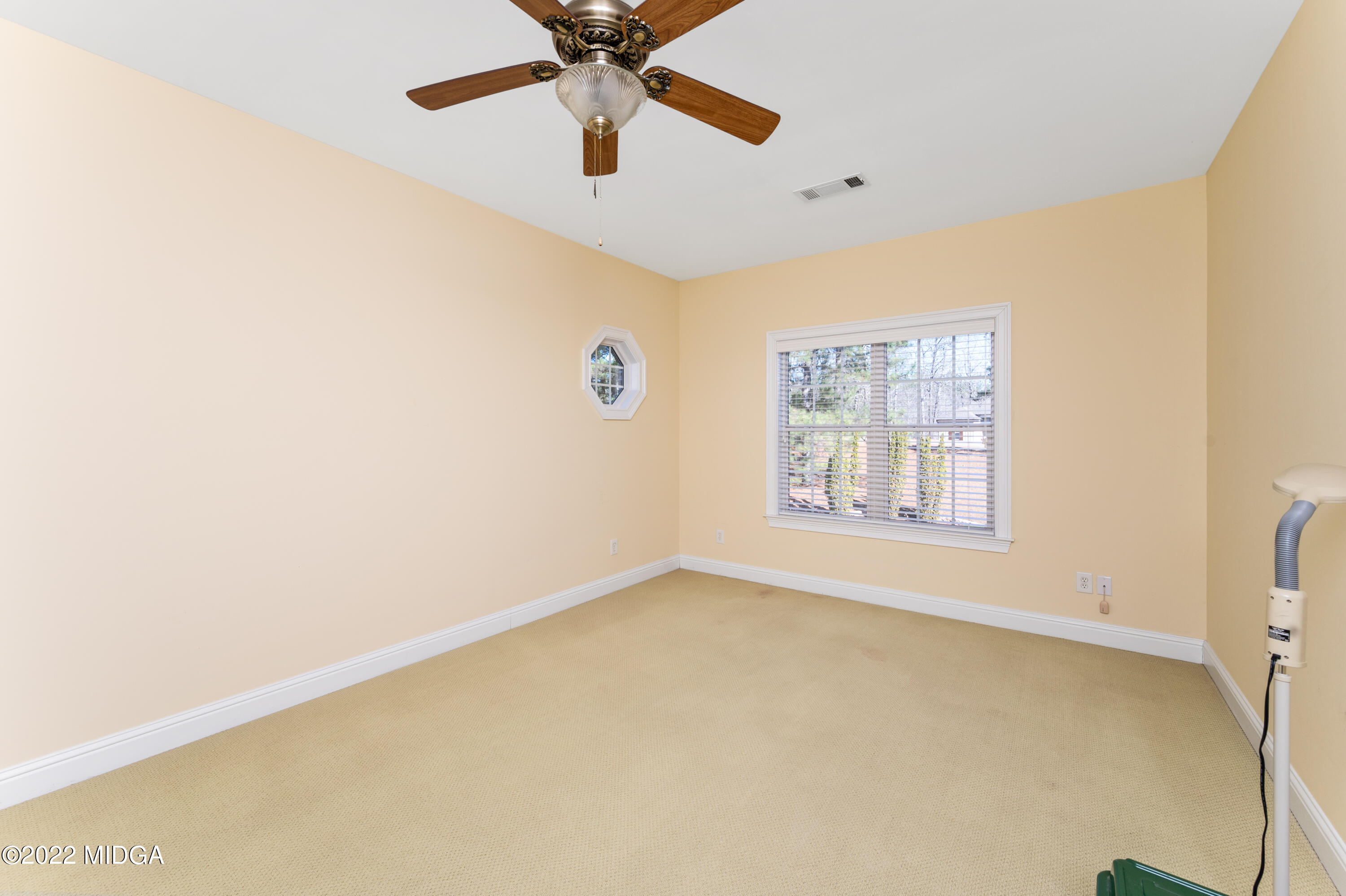 176 Tumbling Shoals Drive Gray, GA 31032 - Photo 35 of 51 a view of an empty room with a window