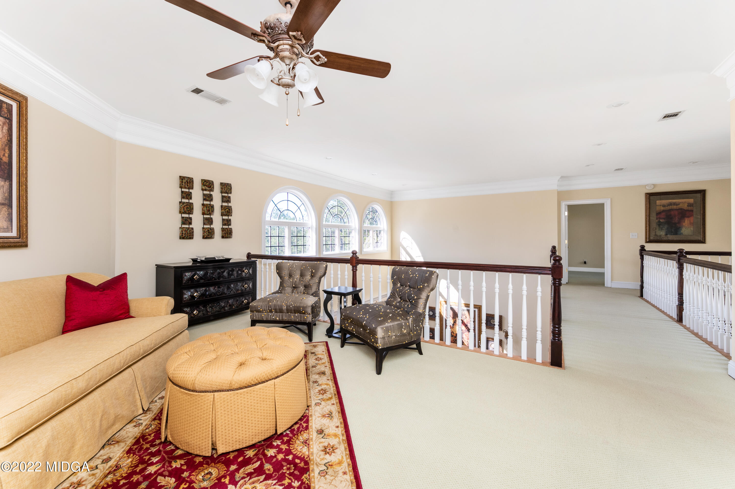 176 Tumbling Shoals Drive Gray, GA 31032 - Photo 40 of 51 a living room with furniture and a flat screen tv