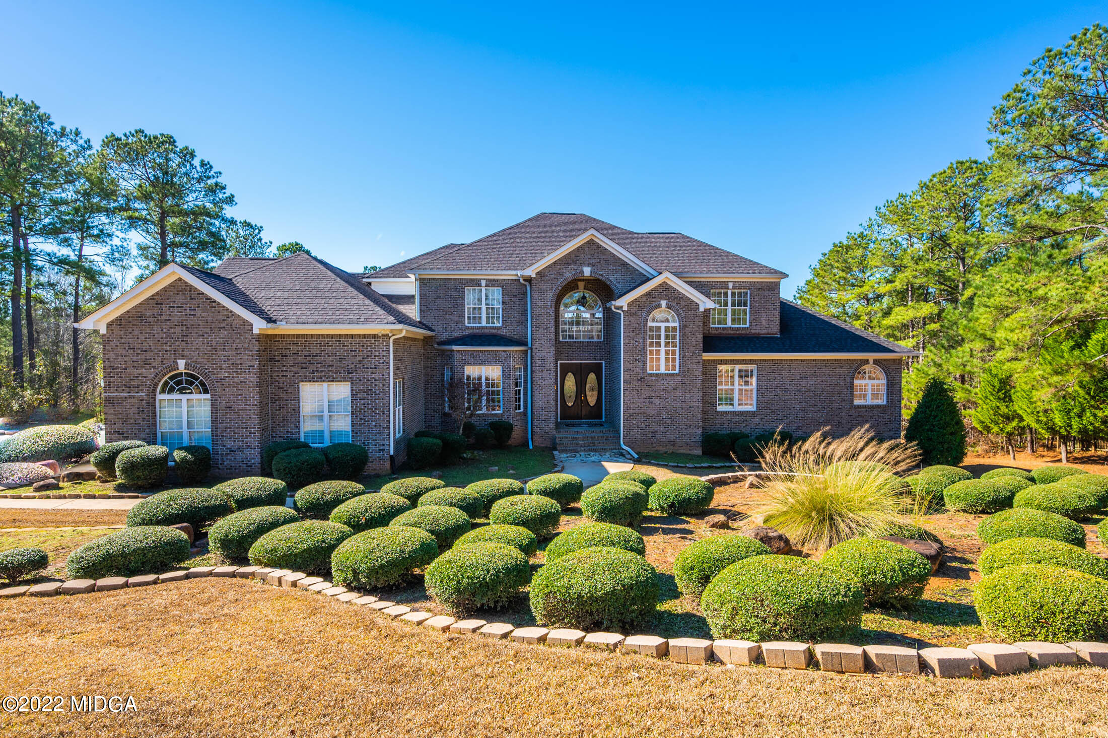 176 Tumbling Shoals Drive Gray, GA 31032 - Photo 4 of 51 a front view of a house with a yard