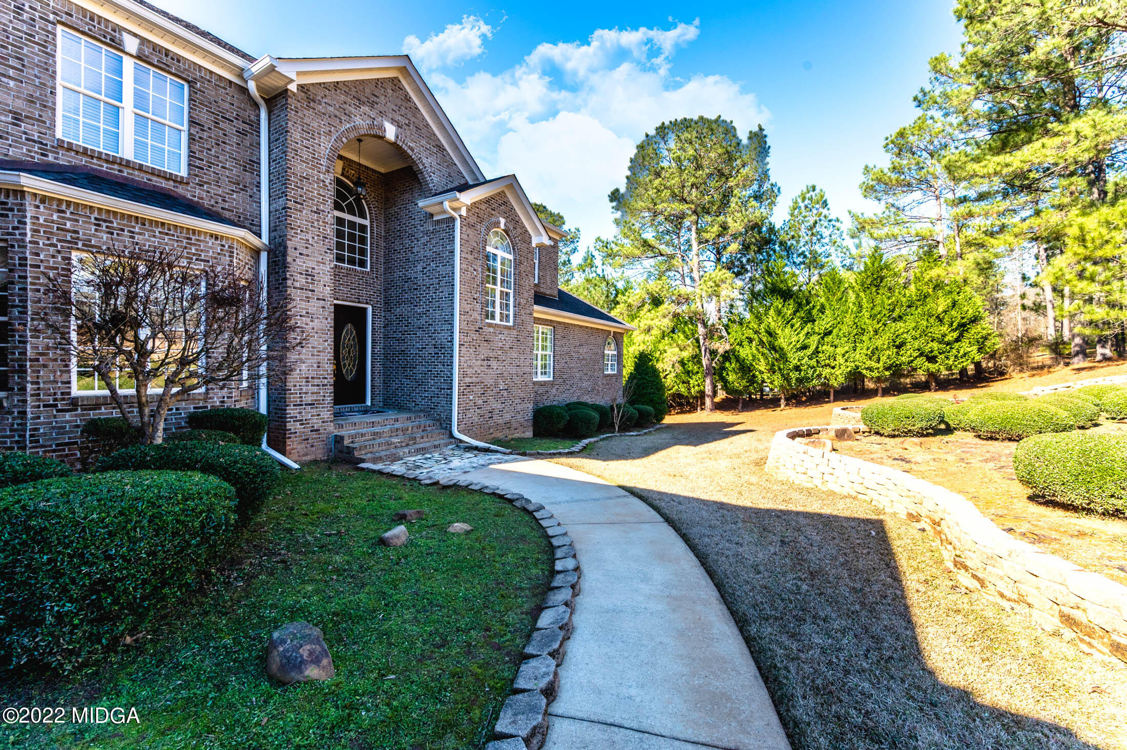 176 Tumbling Shoals Drive Gray, GA 31032 - Photo 7 of 51 a house with garden in front of it
