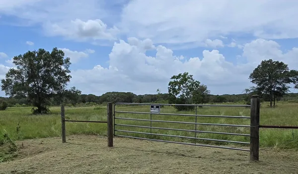 a view of a bench in a field
