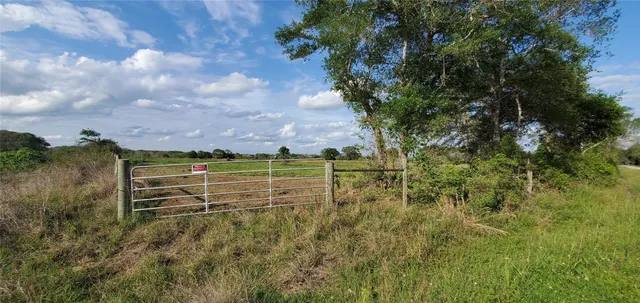 a view of a golf course with a house