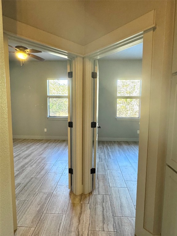 290 Hugo Road, Unit A San Marcos, TX 78666 - Photo 12 of 25 a view of a room with wooden floor and staircase