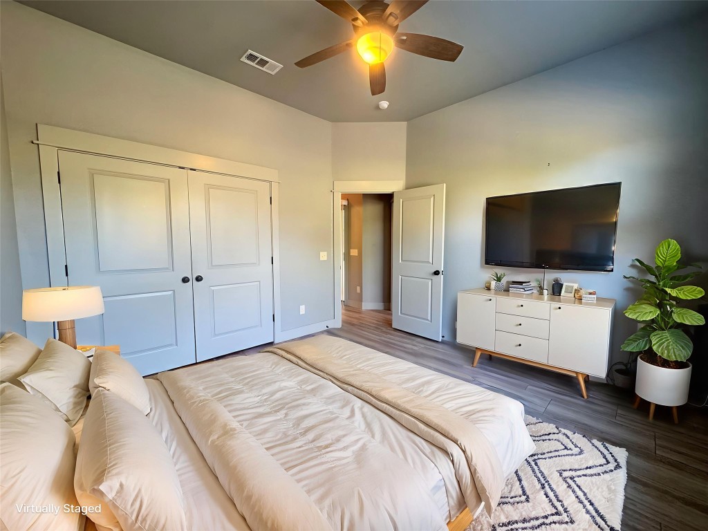 290 Hugo Road, Unit A San Marcos, TX 78666 - Photo 13 of 25 a bedroom with a bed and a flat screen tv
