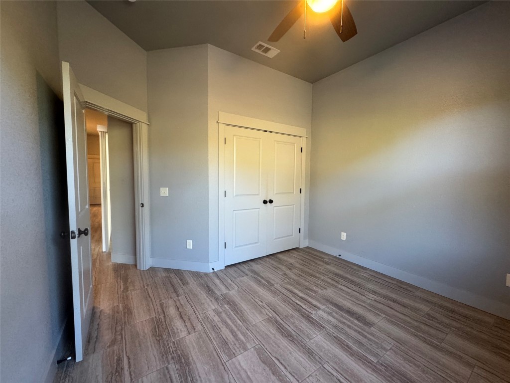 290 Hugo Road, Unit A San Marcos, TX 78666 - Photo 16 of 25 wooden floor in an empty room