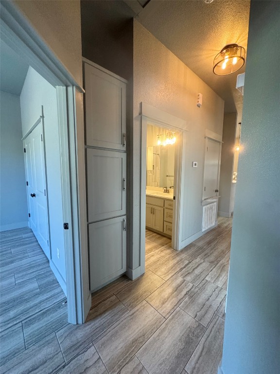 290 Hugo Road, Unit A San Marcos, TX 78666 - Photo 17 of 25 a view of a refrigerator in kitchen and wooden floor