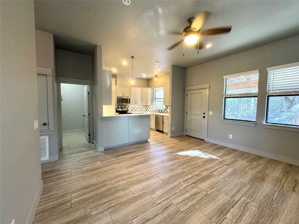 290 Hugo Road, Unit A San Marcos, TX 78666 - Photo 5 of 25 a view of a kitchen with a sink and a window