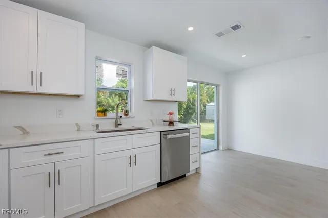 a kitchen with sink and window
