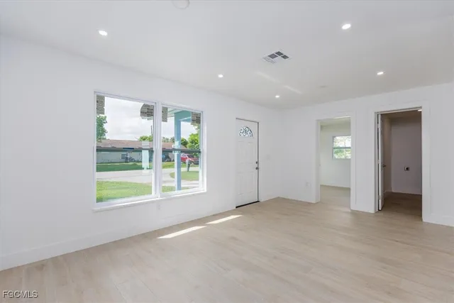 a view of an empty room with a window