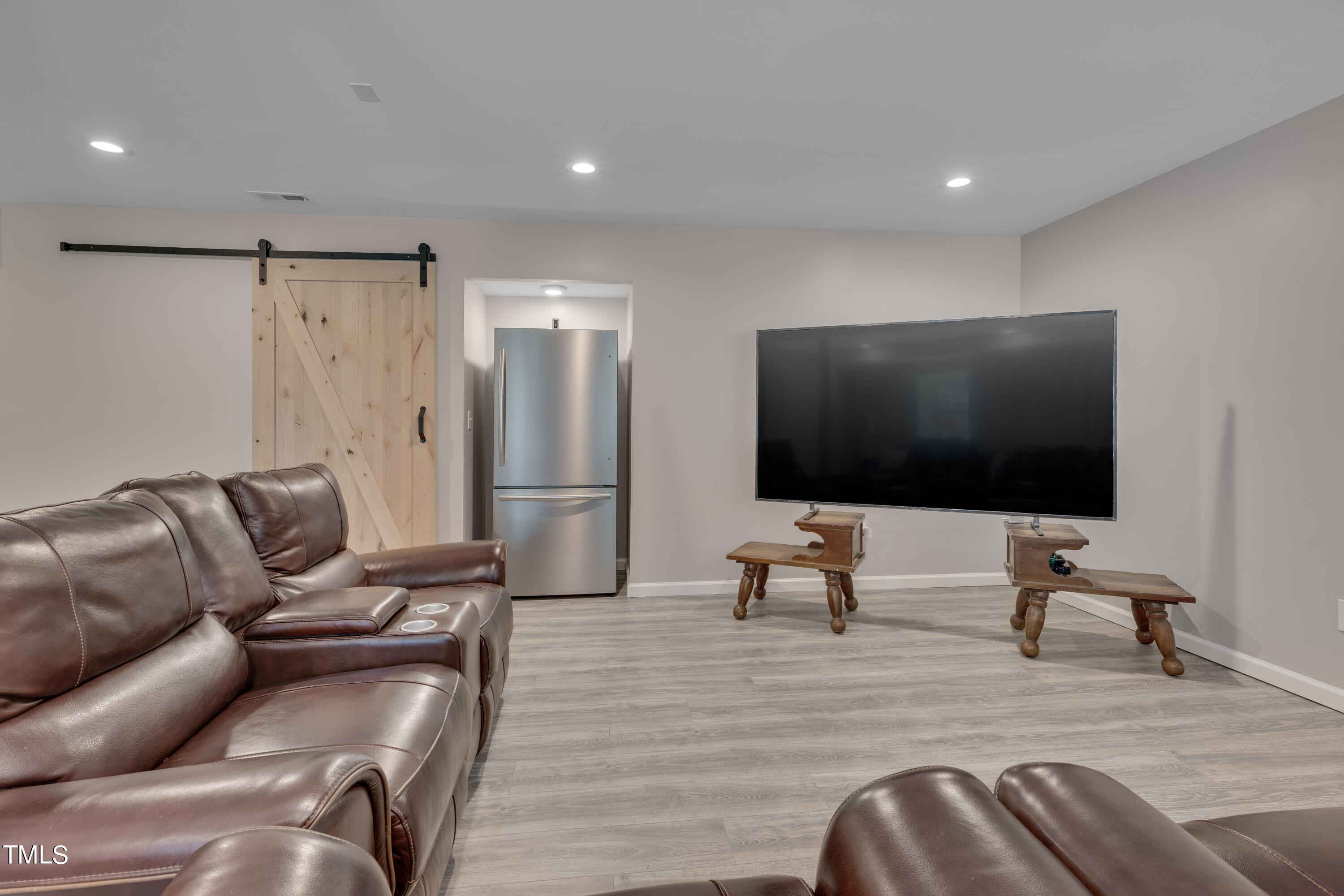1620 Riddle Road Durham, NC 27713 - Photo 12 of 18 a living room with furniture and a flat screen tv