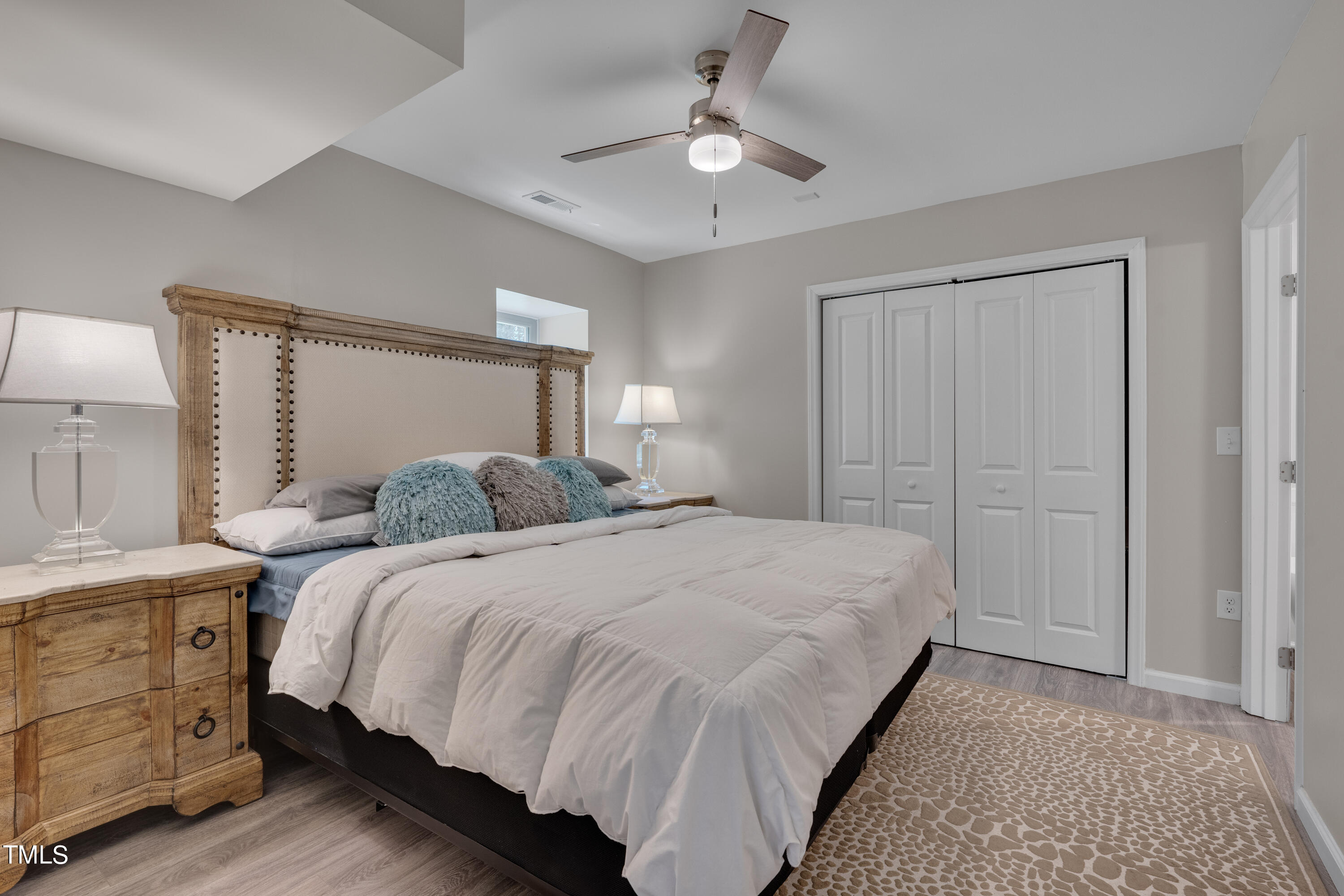 1620 Riddle Road Durham, NC 27713 - Photo 13 of 18 a bed room with a bed and a night stand