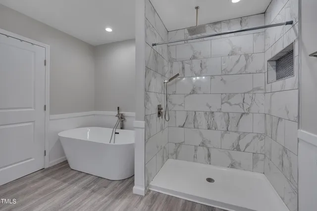 a bathroom with a bathtub and shower