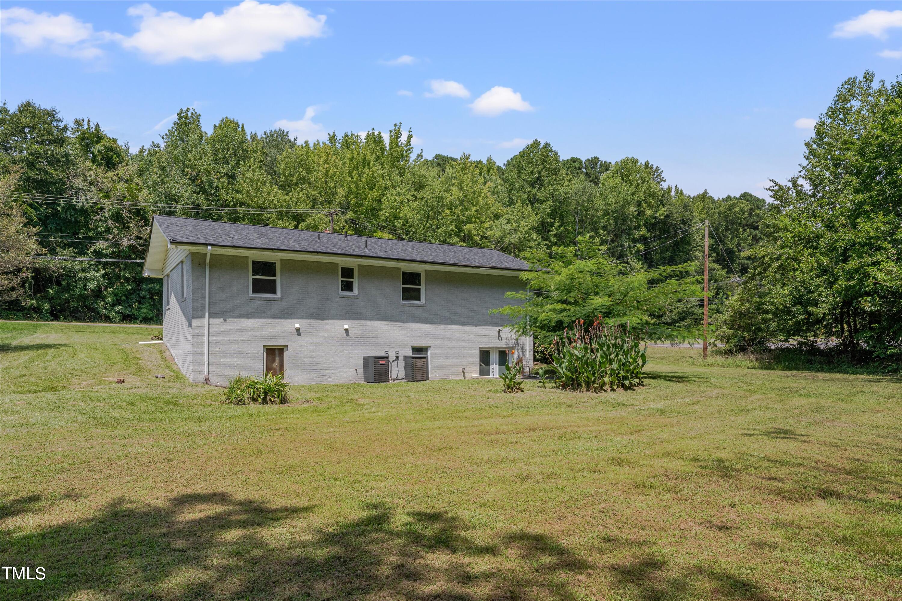 1620 Riddle Road Durham, NC 27713 - Photo 17 of 18 a view of a house with backyard and garden
