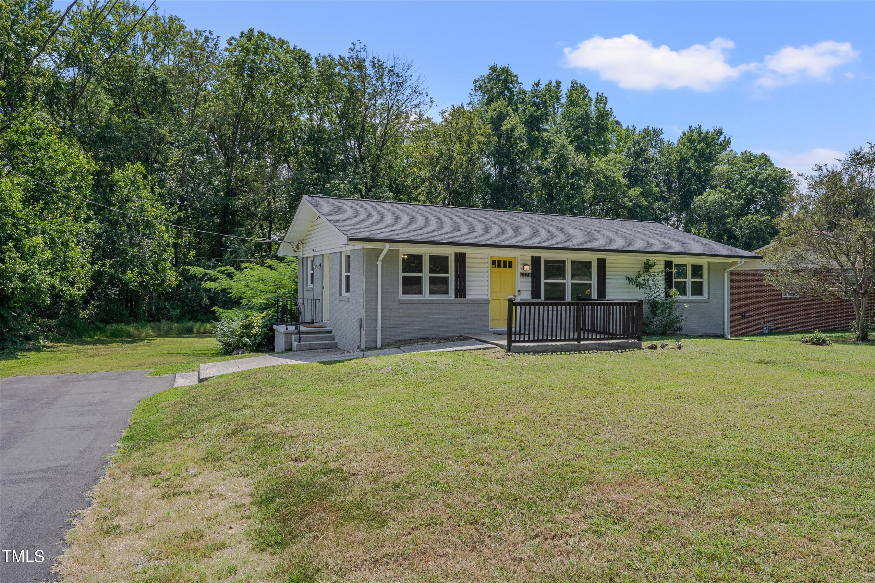 1620 Riddle Road Durham, NC 27713 - Photo 2 of 18 a house with trees in the background