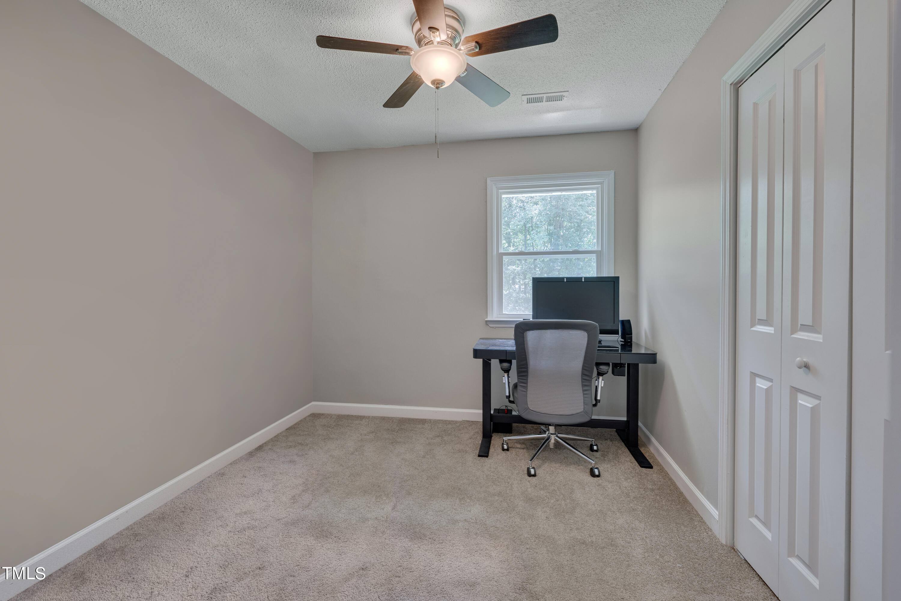 1620 Riddle Road Durham, NC 27713 - Photo 8 of 18 a view of a workspace with furniture and a window