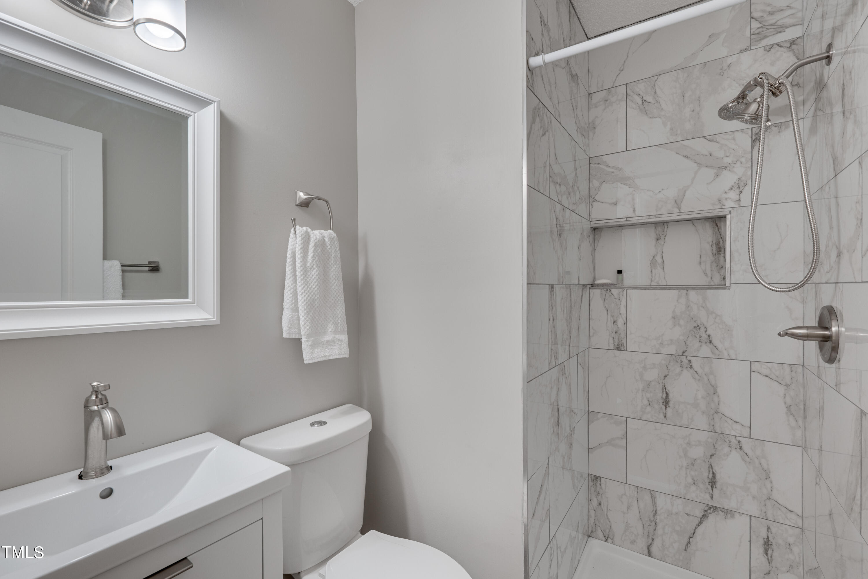 1620 Riddle Road Durham, NC 27713 - Photo 9 of 18 a bathroom with a sink toilet and shower