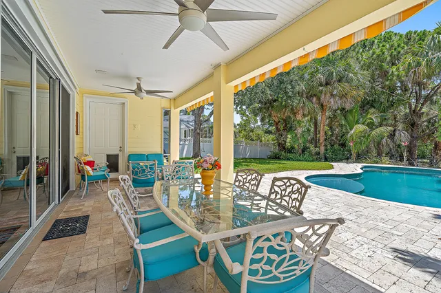 a view of an outdoor dining space with furniture