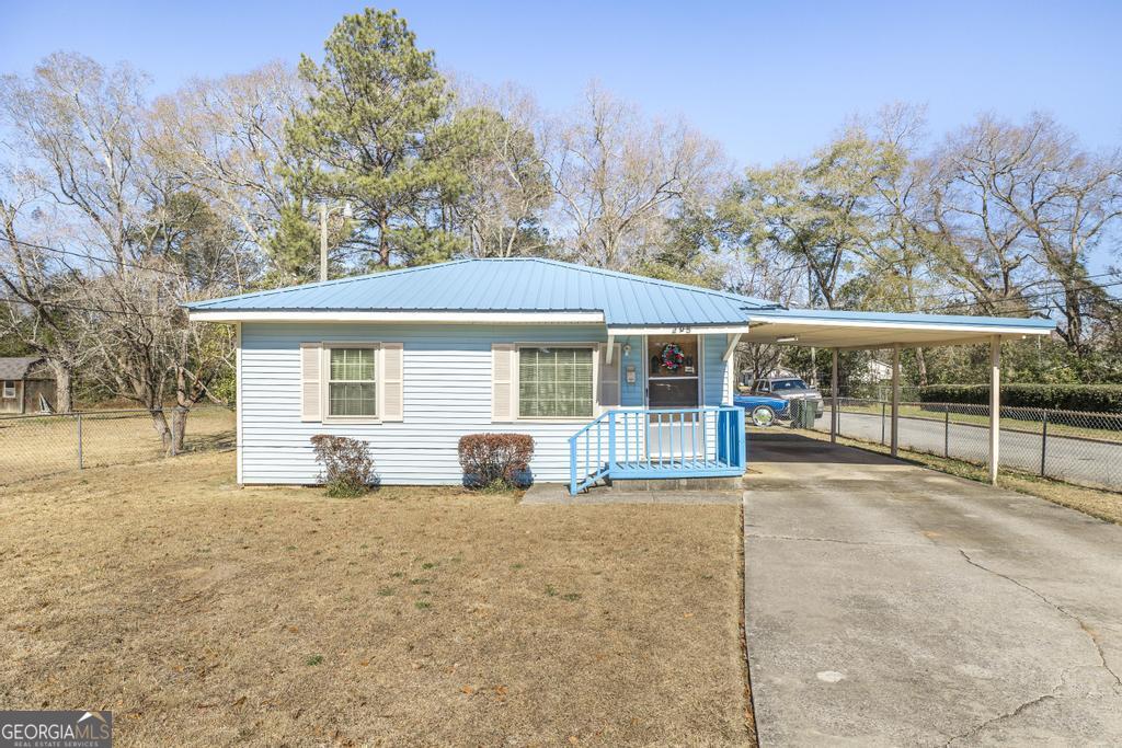 a view of house with outdoor seating