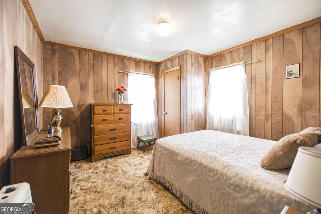 205 Georgia Avenue Fort Valley, GA 31030 - Photo 18 of 23 a bedroom with a bed and a dresser