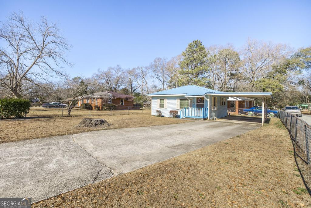 205 Georgia Avenue Fort Valley, GA 31030 - Photo 2 of 23 a front view of houses with yard