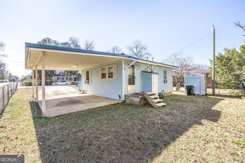 205 Georgia Avenue Fort Valley, GA 31030 - Photo 22 of 23 a view of a house with backyard and porch
