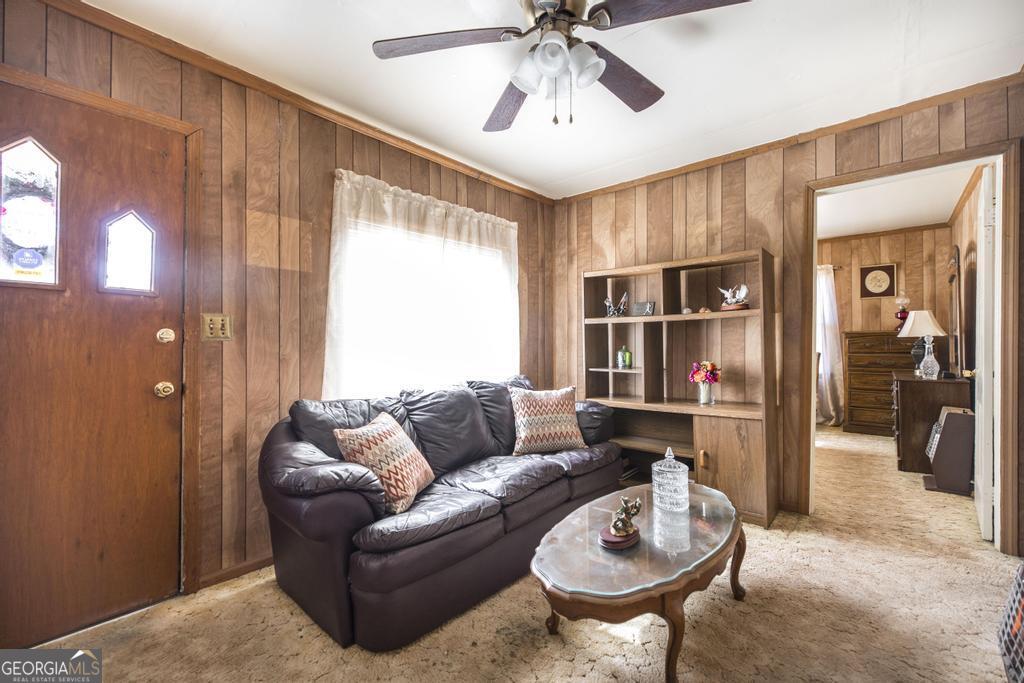 205 Georgia Avenue Fort Valley, GA 31030 - Photo 9 of 23 a living room with furniture a ceiling fan and a window