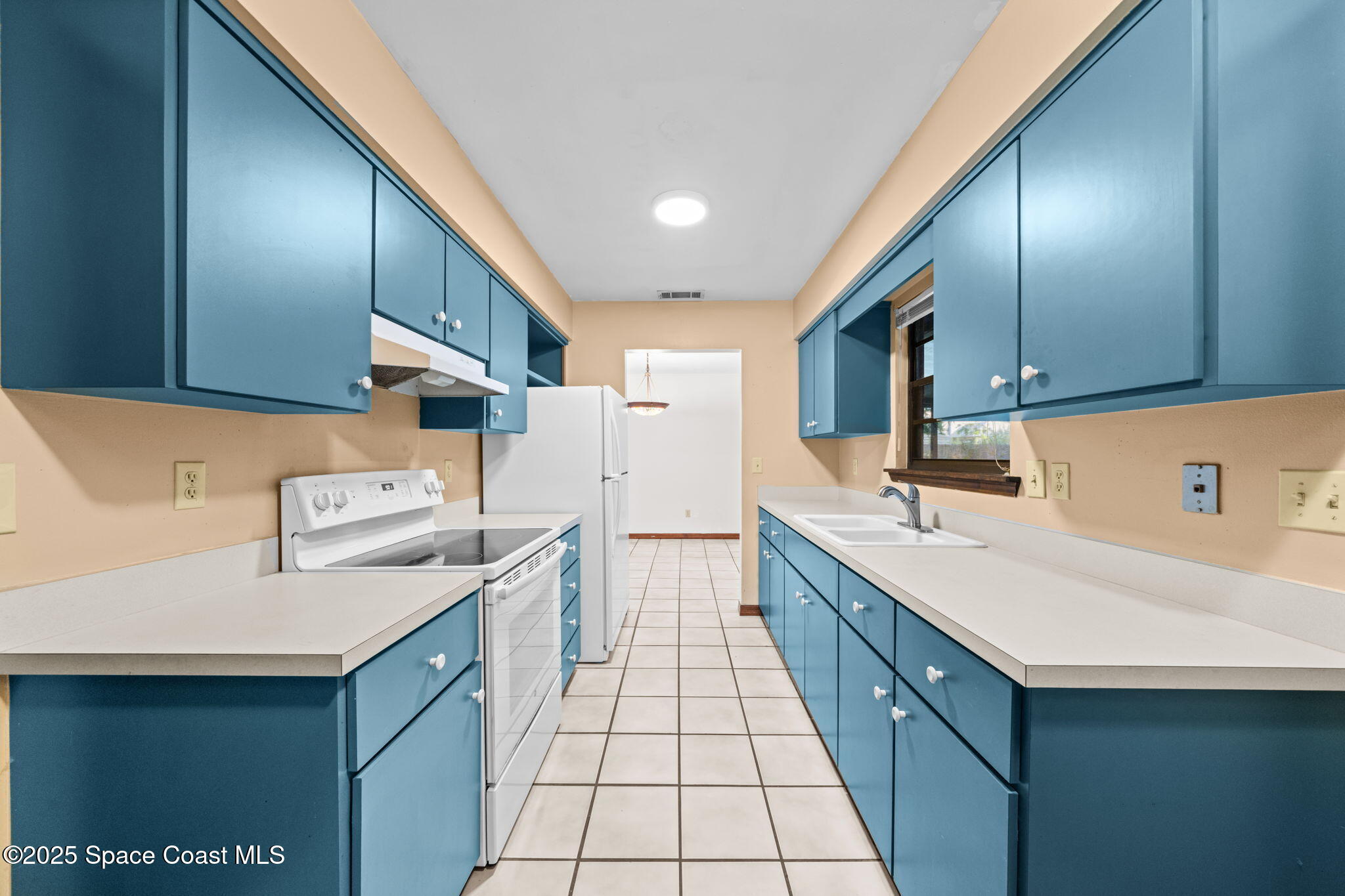 410 Albenga Road Northwest Palm Bay, FL 32907 - Photo 11 of 23 a kitchen with stainless steel appliances granite countertop a sink a stove and a refrigerator