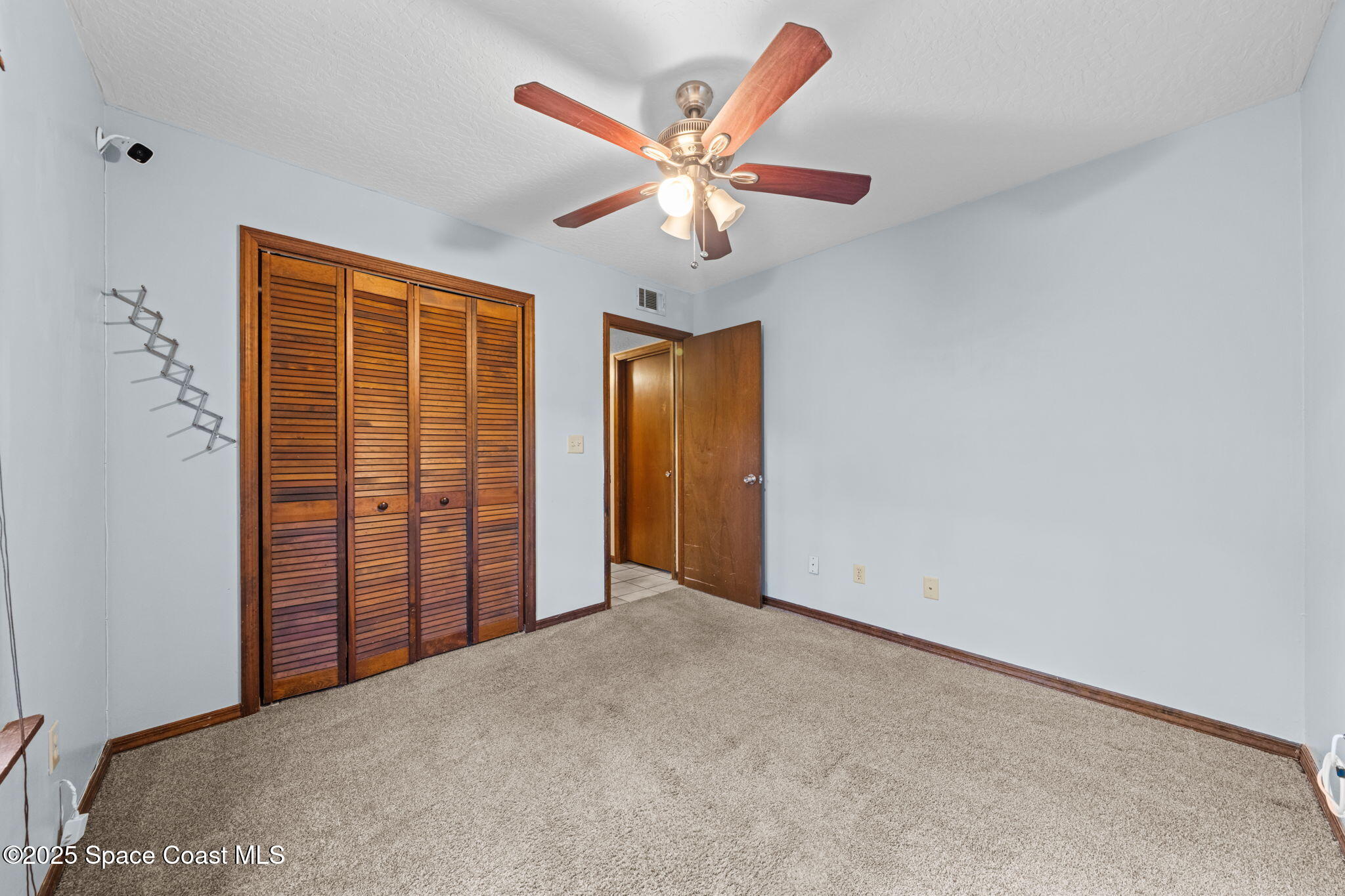 410 Albenga Road Northwest Palm Bay, FL 32907 - Photo 13 of 23 a view of livingroom with ceiling fan
