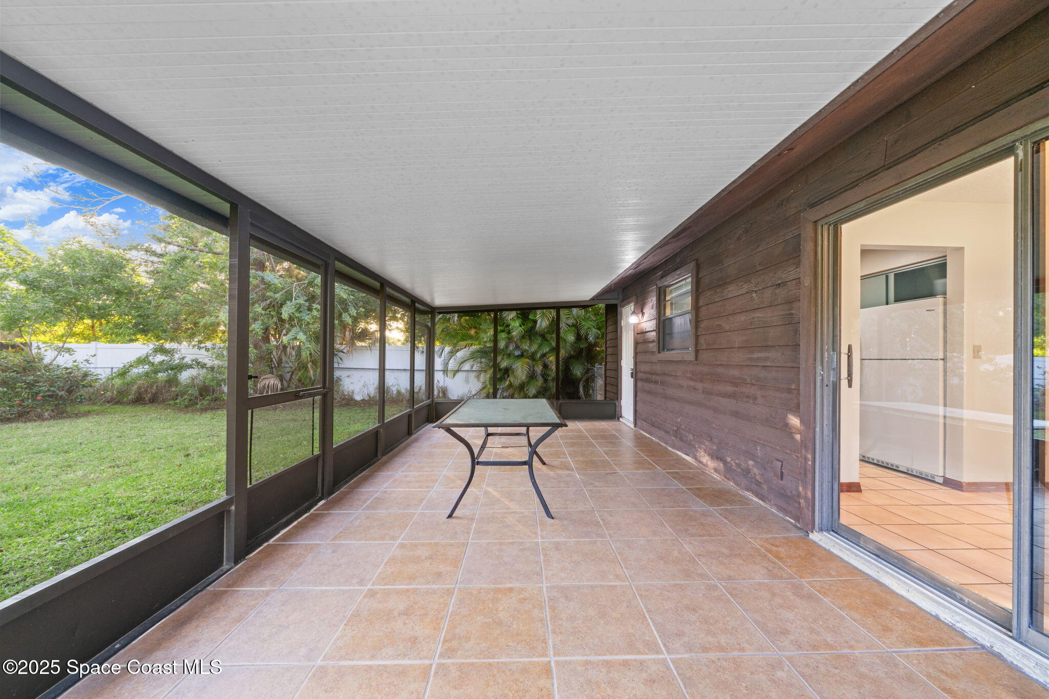 410 Albenga Road Northwest Palm Bay, FL 32907 - Photo 16 of 23 a view of two chairs in balcony with garden