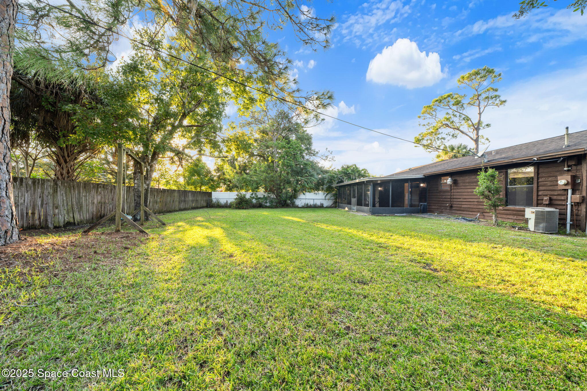 410 Albenga Road Northwest Palm Bay, FL 32907 - Photo 19 of 23 a front view of a house with a yard