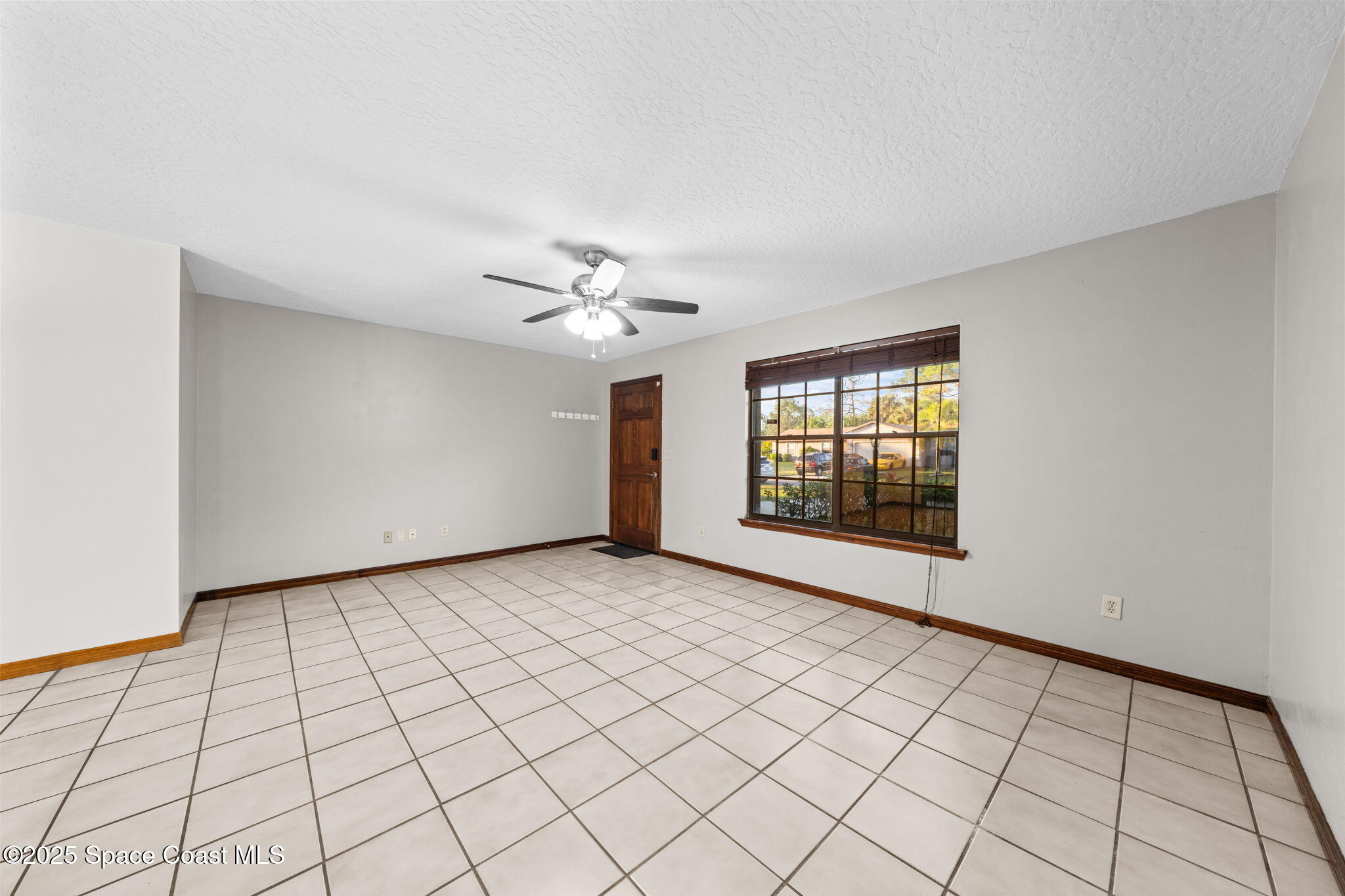 410 Albenga Road Northwest Palm Bay, FL 32907 - Photo 7 of 23 a view of an empty room and window