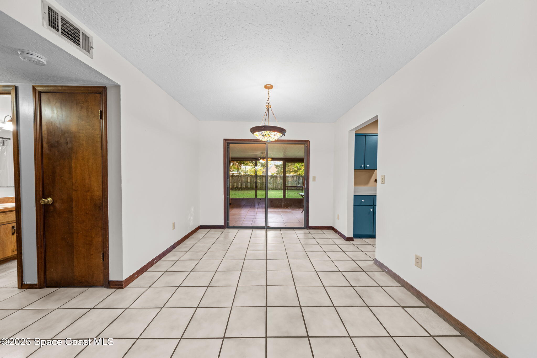 410 Albenga Road Northwest Palm Bay, FL 32907 - Photo 10 of 23 a view of an empty room and window