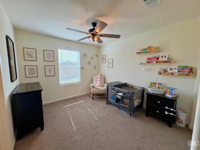 a bedroom with furniture and a chandelier