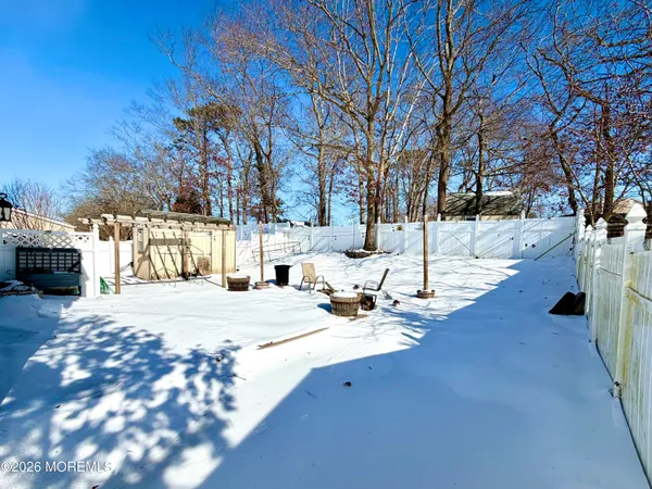a kitchen with stainless steel appliances granite countertop a refrigerator a stove and a wooden floors