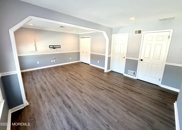 a view of a livingroom with wooden floor