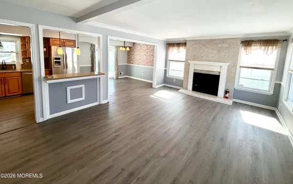 a kitchen with stainless steel appliances a refrigerator sink and microwave