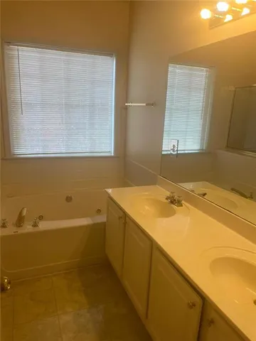 a bathroom with a sink and a bathtub