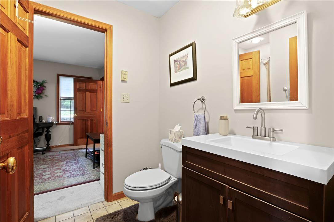 209 Remington Road East Stroudsburg, PA 18301 - Photo 21 of 41 A well-appointed bathroom with a modern vanity and warm wood accents.