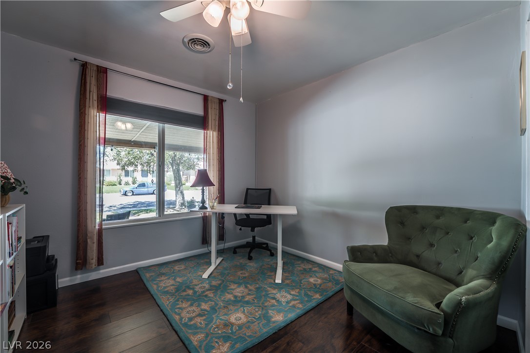1324 Appaloosa Road Boulder City, NV 89005 - Photo 30 of 42 Hardwood floors and a large window illuminate this inviting home office space.