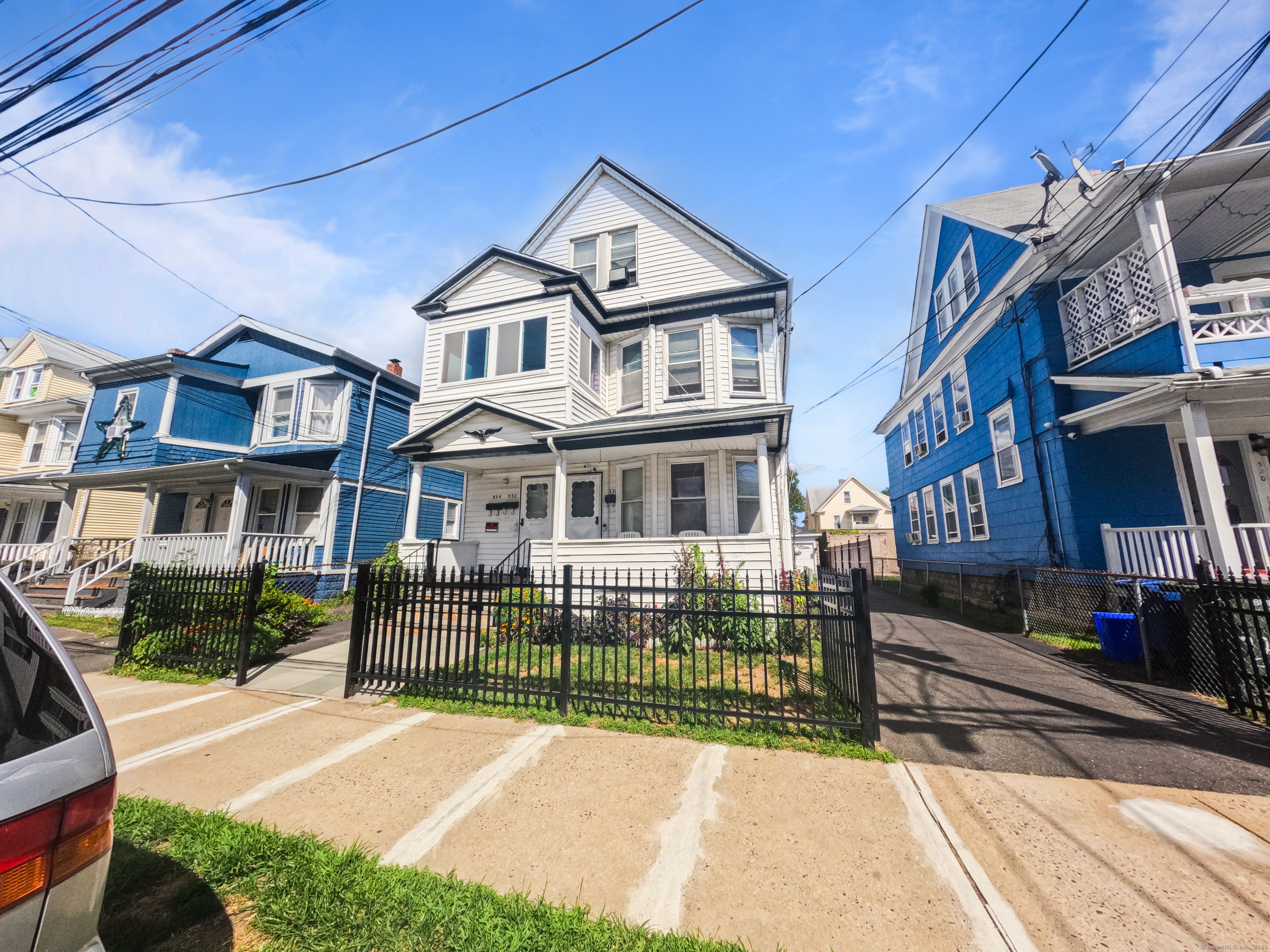 532 Carroll Avenue, Unit 2 Bridgeport, CT 06607 - Photo 1 of 16 a front view of a house with a garden
