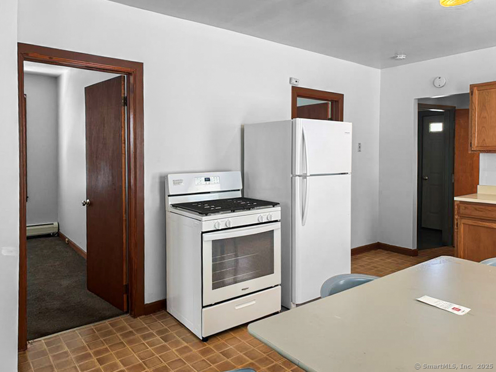 532 Carroll Avenue, Unit 2 Bridgeport, CT 06607 - Photo 11 of 16 a kitchen with a refrigerator sink and cabinets