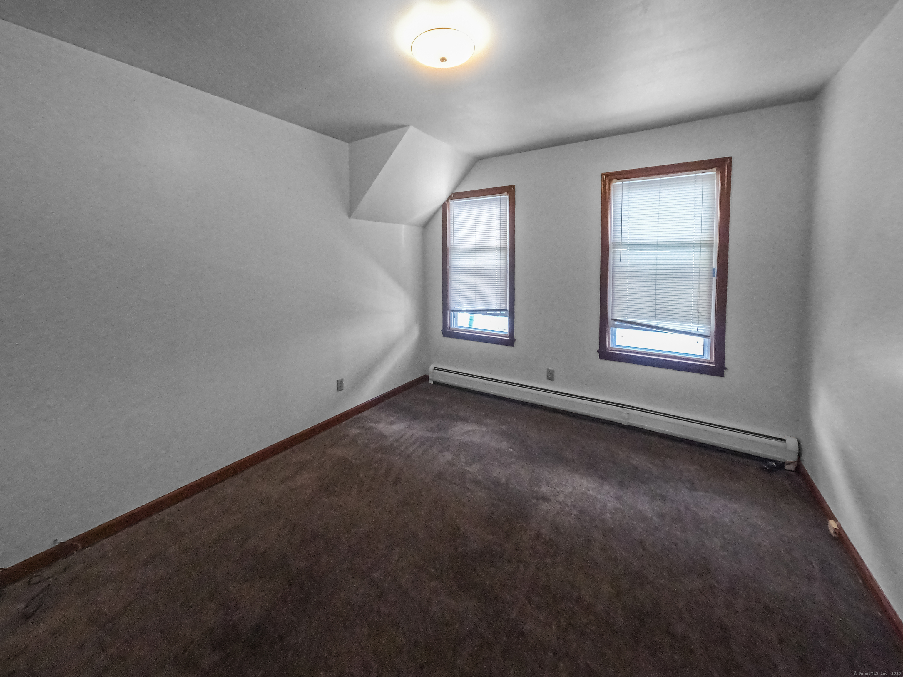 532 Carroll Avenue, Unit 2 Bridgeport, CT 06607 - Photo 14 of 16 an empty room with windows