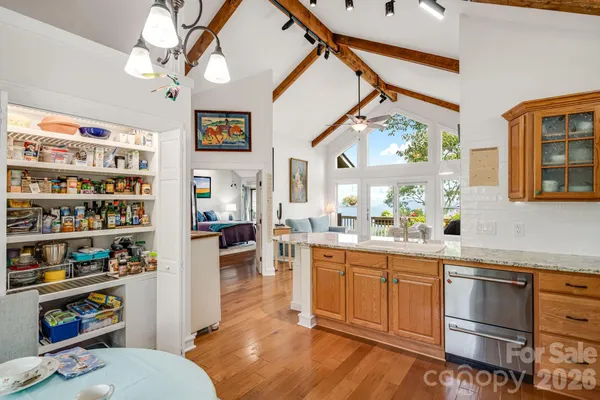 a open kitchen with stainless steel appliances granite countertop a stove and cabinets
