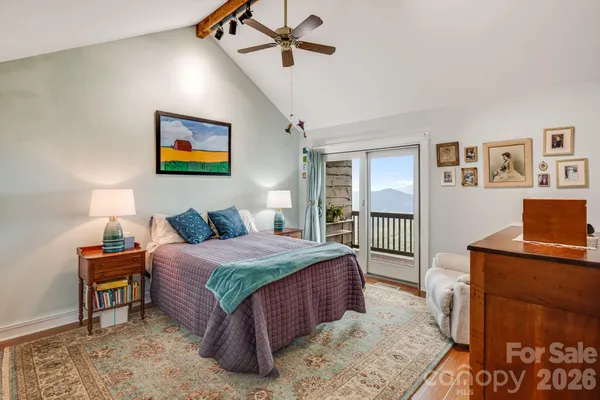 a bedroom with a bed and a desk