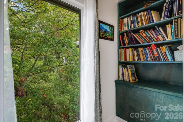 a view of a book shelf in a room