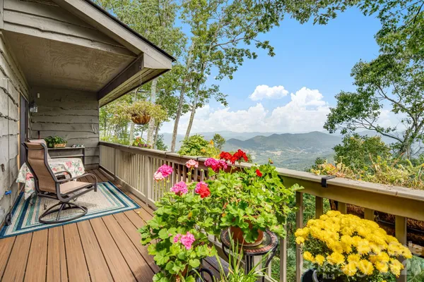 a view of a balcony with wooden floor