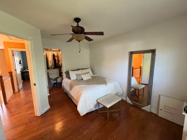 a bedroom with furniture and a window