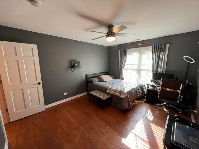 a bathroom with a toilet and a mirror