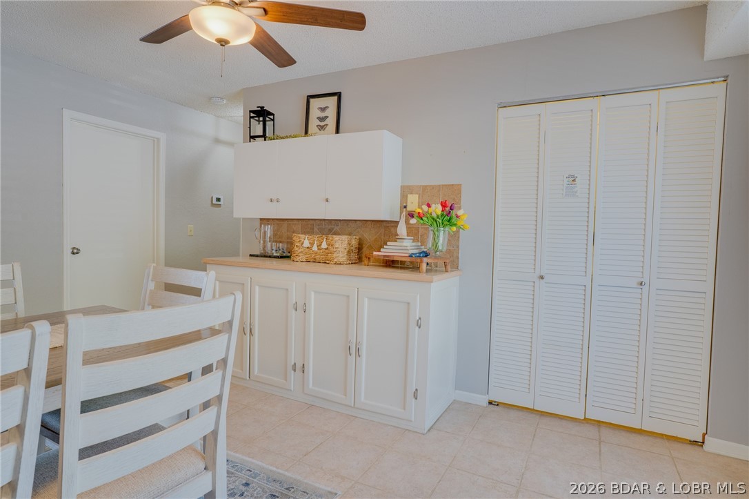 775 Winn Road, Unit 4L Osage Beach, MO 65065 - Photo 14 of 39 View of kitchen with the doors to the washer/dryer