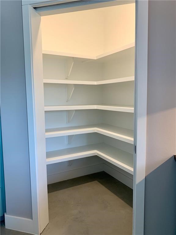 2117 Pershing Drive Austin, TX 78723 - Photo 5 of 30 Large kitchen pantry with pocket door.